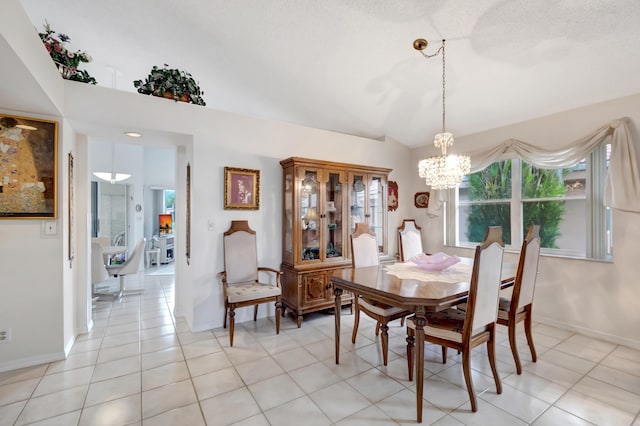 dining space featuring a textured ceiling, light tile patterned floors, lofted ceiling, and a notable chandelier