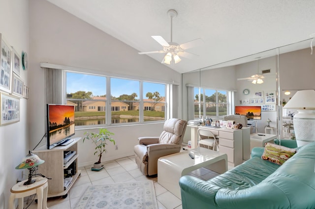 living room with light tile patterned floors, high vaulted ceiling, and ceiling fan