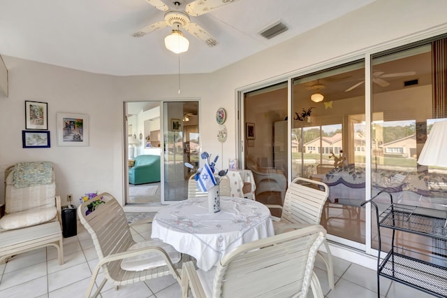 interior space with ceiling fan