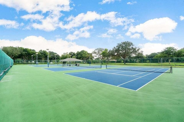 view of tennis court featuring basketball court