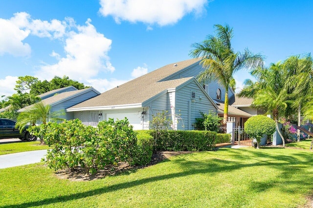 view of home's exterior featuring a lawn and a garage