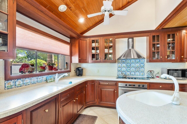 kitchen featuring sink, wall chimney exhaust hood, wooden ceiling, stainless steel appliances, and vaulted ceiling