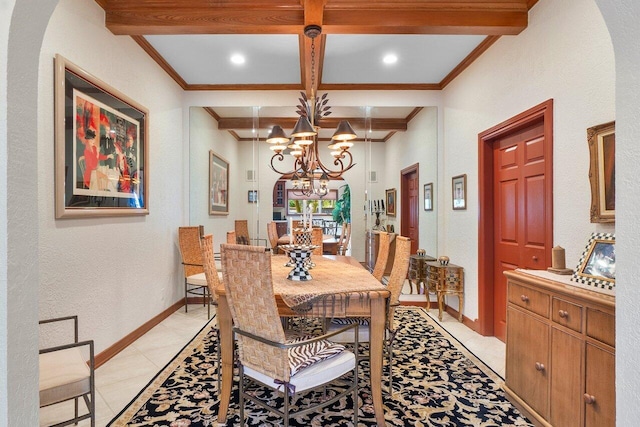 dining space with beam ceiling, light tile patterned floors, crown molding, and a chandelier