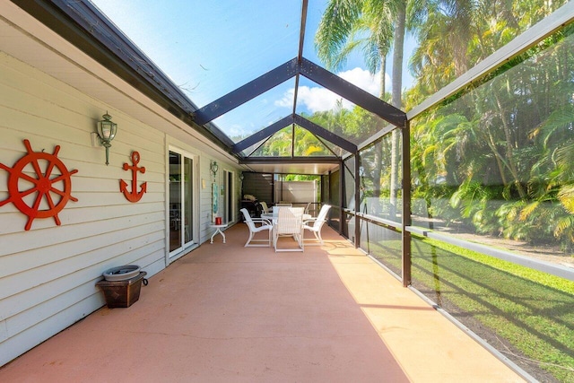 sunroom / solarium featuring vaulted ceiling