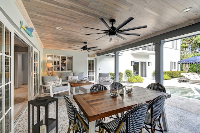 sunroom featuring ceiling fan, wood ceiling, and french doors