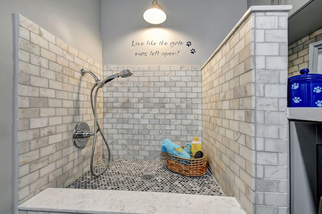 bathroom with a tile shower