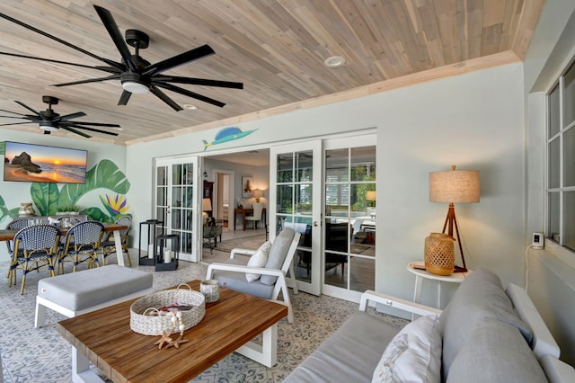 living room featuring french doors, ceiling fan, and wooden ceiling