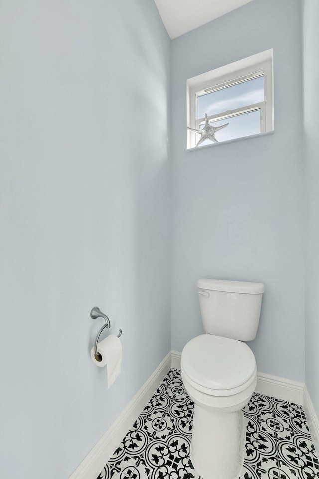 bathroom with tile patterned floors and toilet