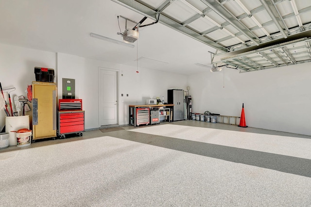 garage with electric panel and a garage door opener