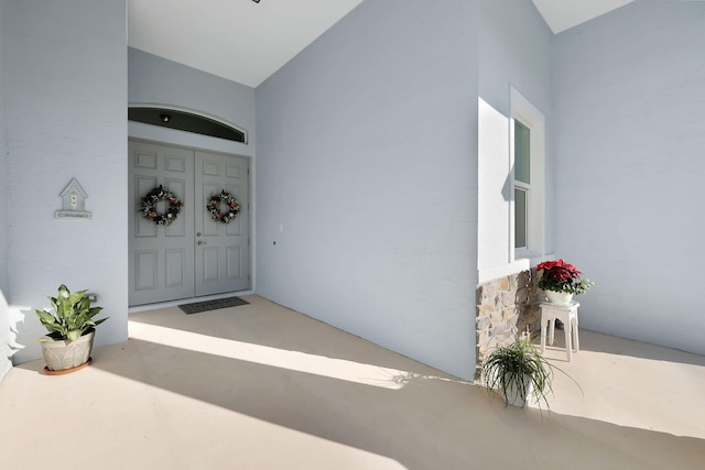 doorway to property with stucco siding