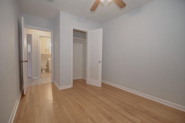 unfurnished bedroom featuring light wood-style floors, a closet, ceiling fan, and baseboards