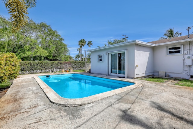 view of pool with a patio area, fence, and a fenced in pool