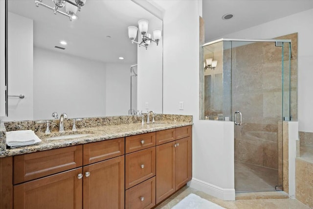 bathroom with vanity and an enclosed shower