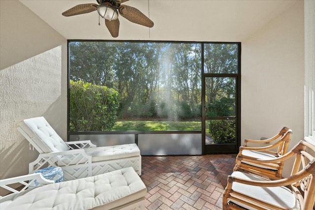 sunroom with plenty of natural light and ceiling fan