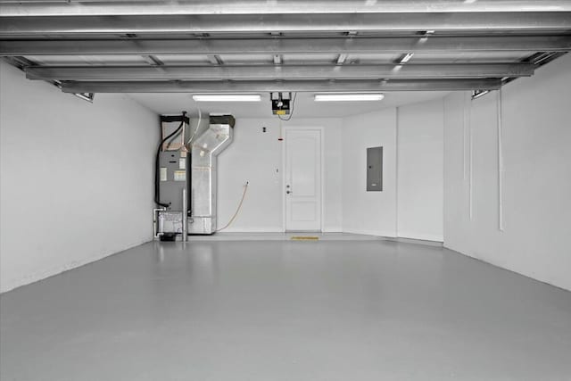 garage with electric panel, water heater, and a garage door opener