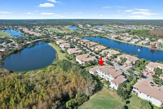 birds eye view of property featuring a water view