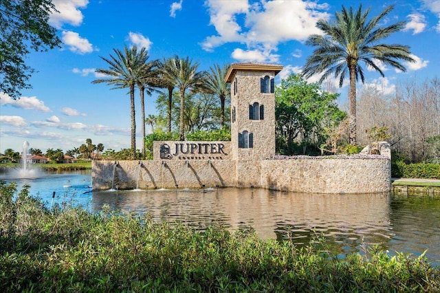 community sign with a water view