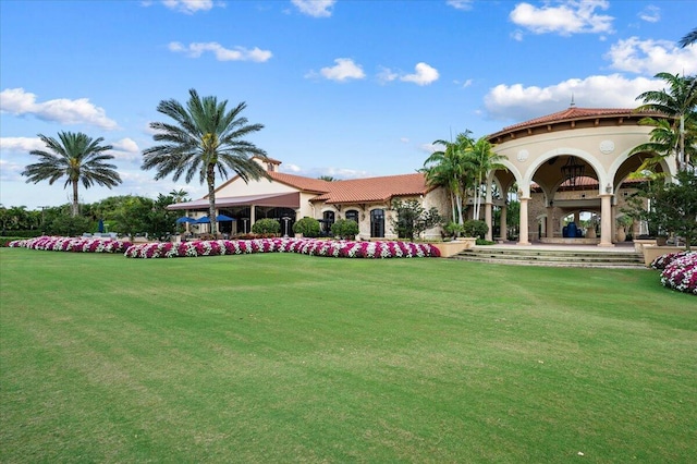 view of home's community with a lawn