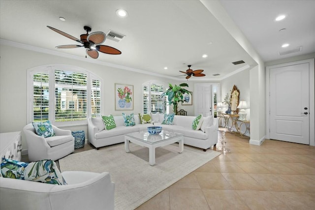 tiled living room with ceiling fan and ornamental molding