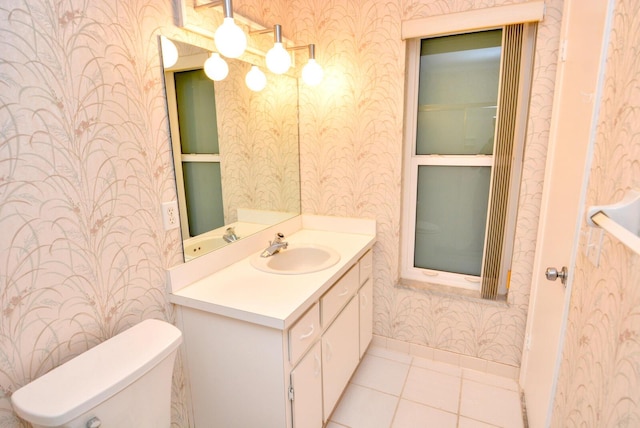 bathroom featuring tile patterned floors, vanity, and toilet