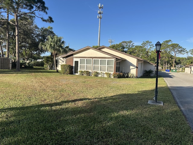 view of property exterior with a yard