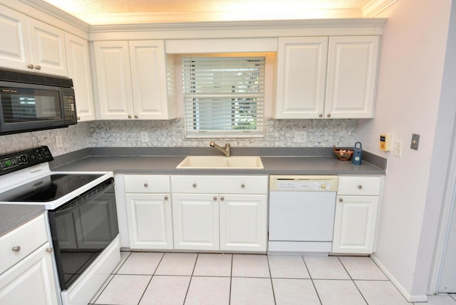 kitchen with decorative backsplash, white appliances, sink, and light tile patterned floors