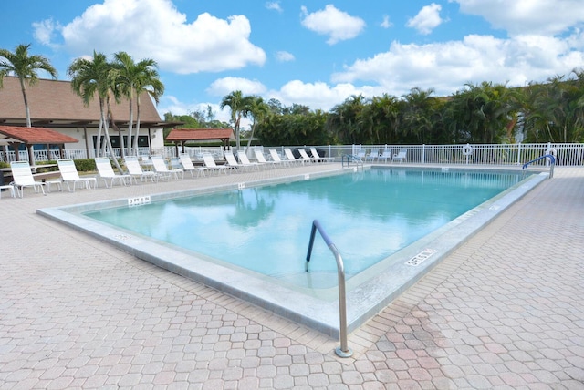 view of swimming pool featuring a patio area