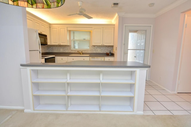 kitchen with tasteful backsplash, ceiling fan, crown molding, sink, and black appliances