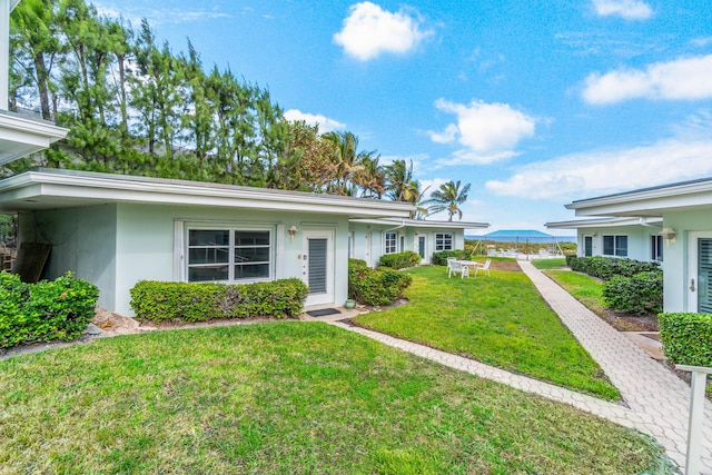 ranch-style house with a front lawn