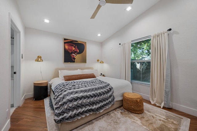 bedroom featuring ceiling fan, hardwood / wood-style floors, and lofted ceiling