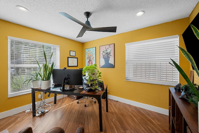 office area featuring ceiling fan, a textured ceiling, and hardwood / wood-style flooring