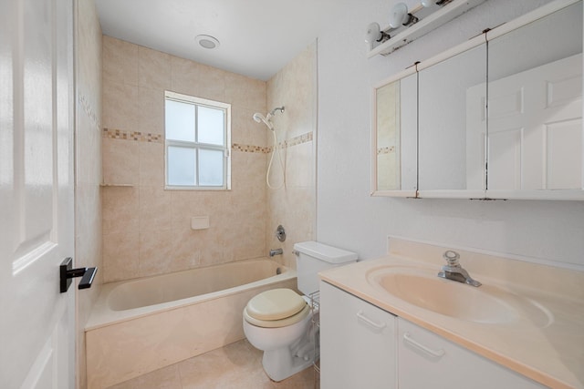 full bathroom featuring tile patterned floors, vanity, toilet, and tiled shower / bath