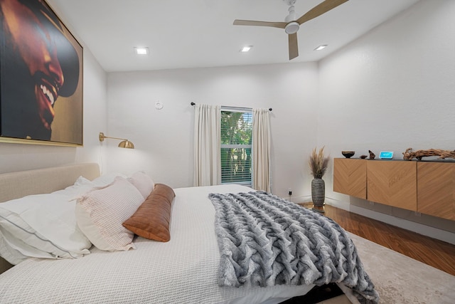 bedroom with ceiling fan and wood-type flooring