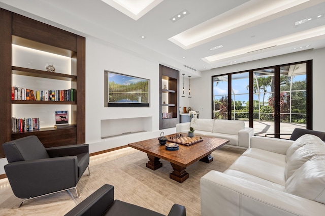 living room with french doors and built in shelves