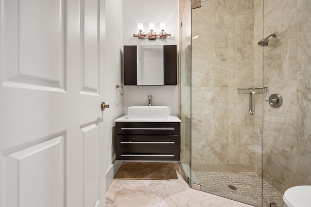 full bathroom featuring toilet, a shower stall, and vanity