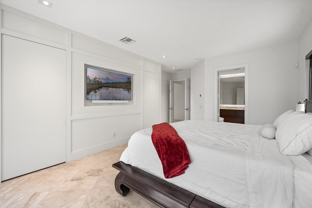 bedroom featuring recessed lighting, visible vents, and ensuite bath