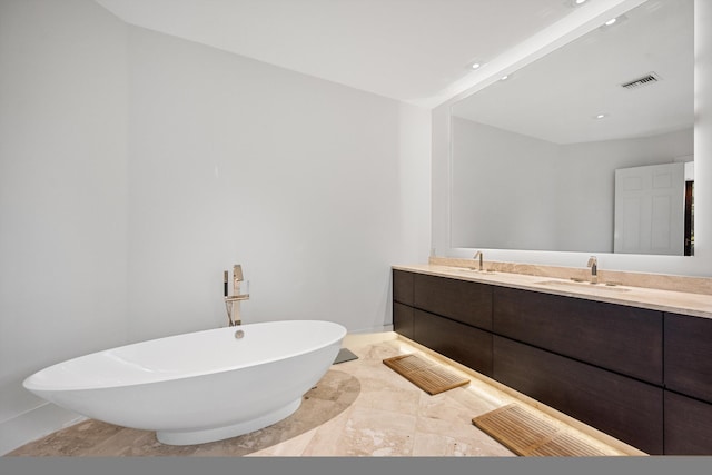 bathroom featuring vanity and a bathing tub