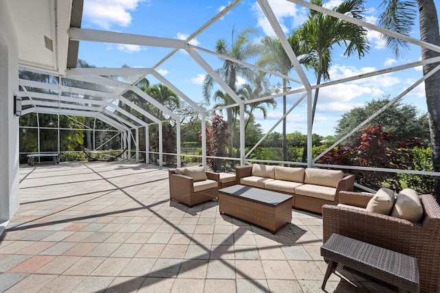 view of patio / terrace featuring a lanai and an outdoor living space