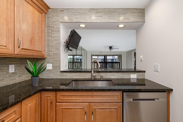 kitchen with stainless steel dishwasher, decorative backsplash, ceiling fan, and sink