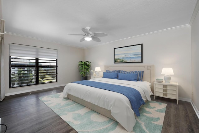 bedroom with dark hardwood / wood-style flooring, ceiling fan, and crown molding