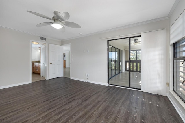 spare room with crown molding, dark hardwood / wood-style flooring, and ceiling fan