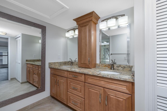 bathroom featuring tile patterned flooring and vanity