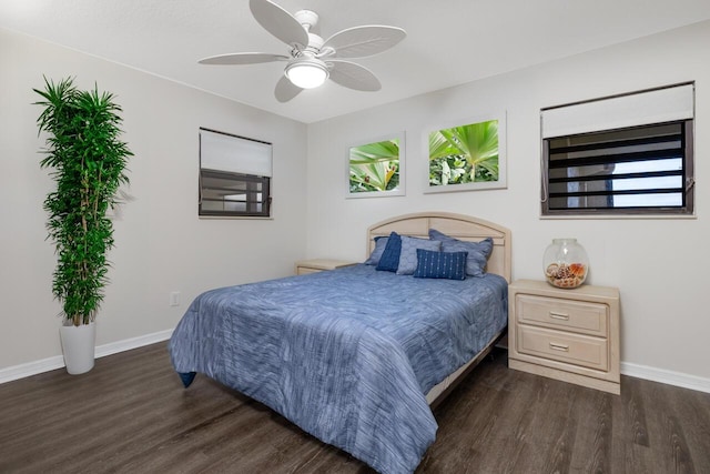 bedroom with ceiling fan and dark hardwood / wood-style floors