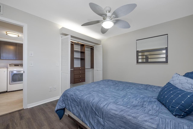 bedroom with a closet, separate washer and dryer, dark hardwood / wood-style floors, and ceiling fan