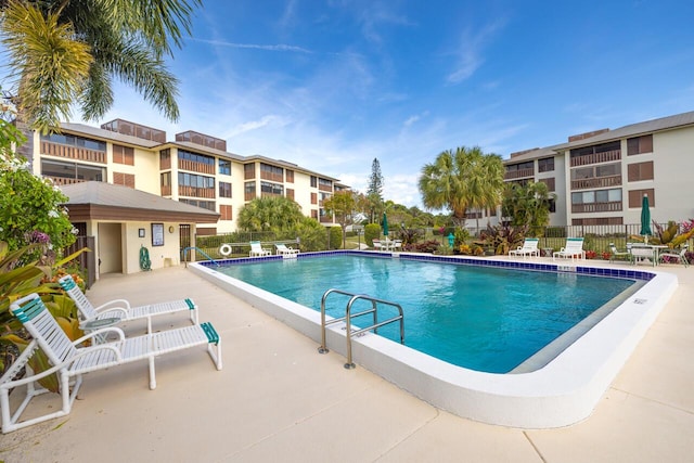 view of swimming pool with a patio