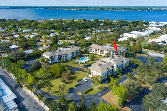 birds eye view of property with a water view