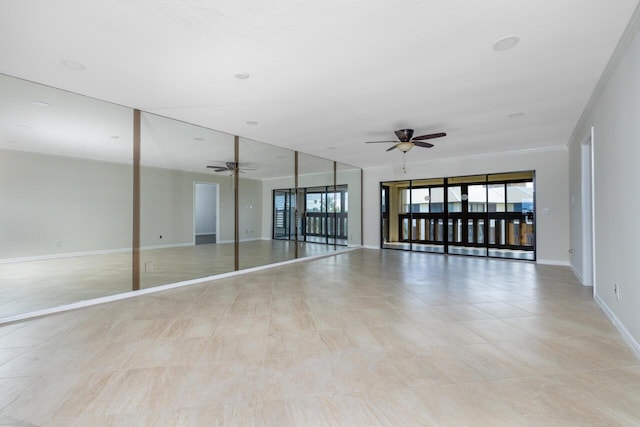 unfurnished room with ceiling fan and crown molding