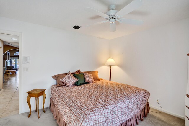 bedroom featuring ceiling fan and a closet