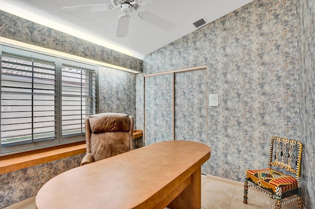 tiled office featuring ceiling fan