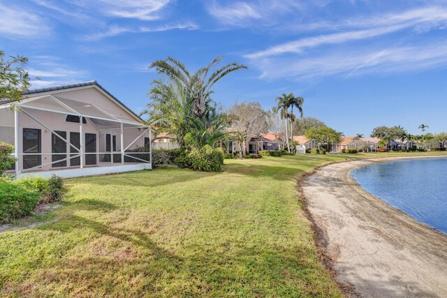 mediterranean / spanish house featuring a front lawn and a garage